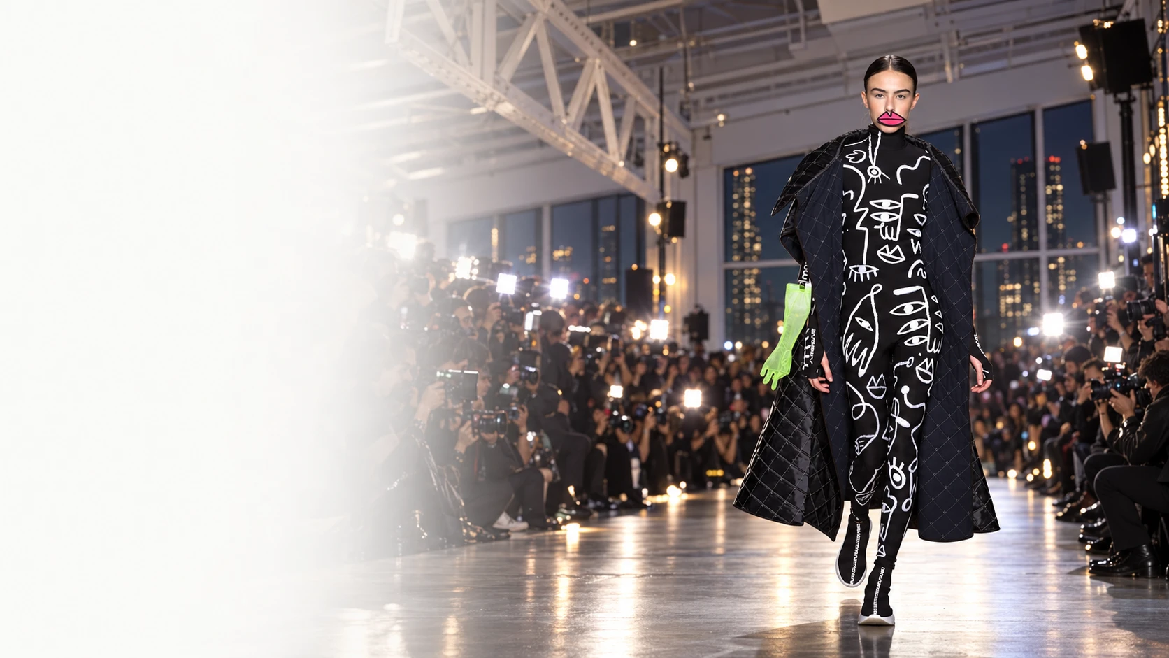 Graphic black collection look under runway lights from the cinematic pitch