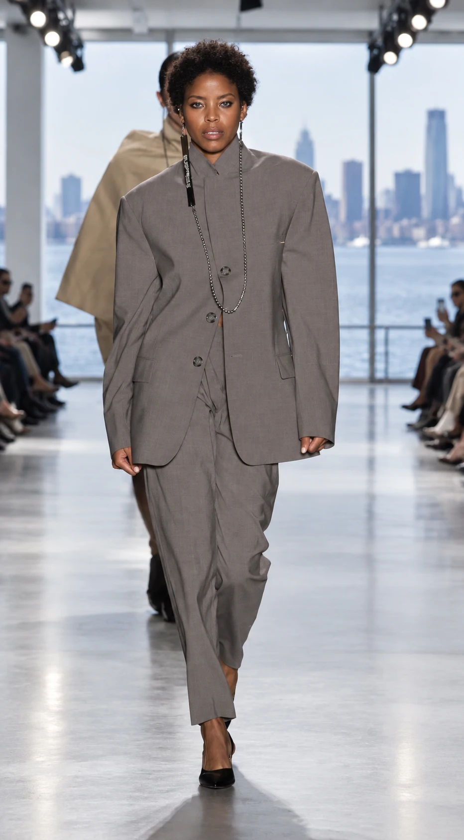 Gray tailored runway look in an editorial studio restaging